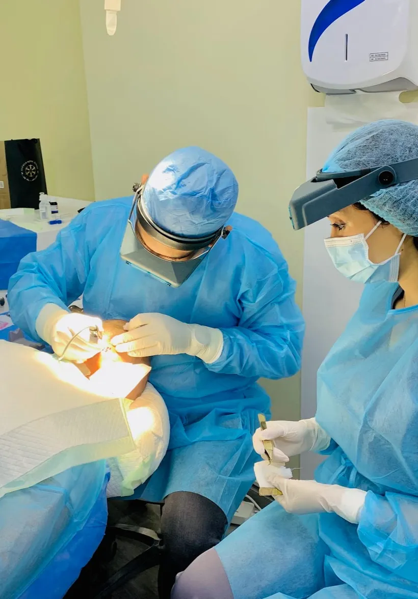 Dr Ahsen Farooque performing a hair transplant procedure in his Dubai clinic